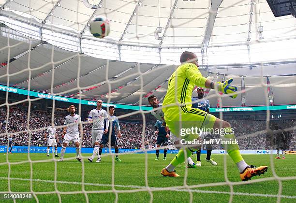 The shot of Jordan Harvey of the Vancouver Whitecaps gets past Evan Bush of the Montreal Impact for a Vancouver goal during their MLS game March 6,...