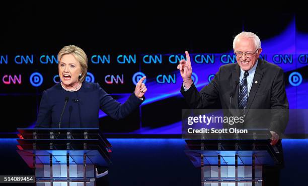 Democratic presidential candidate Senator Bernie Sanders and Democratic presidential candidate Hillary Clinton speak during the CNN Democratic...