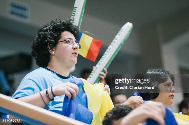 Romanian fans watch a tennis match during day 1 of the Davis Cup World Group first round tie between Romania and Slovenia, on March 4, 2016 in Arad,...