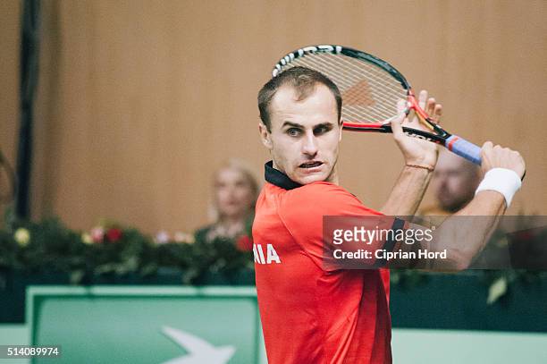 Marius Copil of Romania in action against Blaz Rola of Slovenia during day 1 of the Davis Cup World Group first round tie between Romania and...