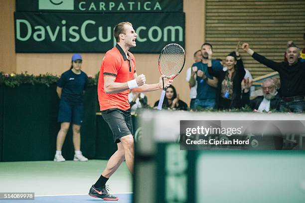 Marius Copil of Romania enjoys his victory over Blaz Rola of Slovenia during day 1 of the Davis Cup World Group first round tie between Romania and...