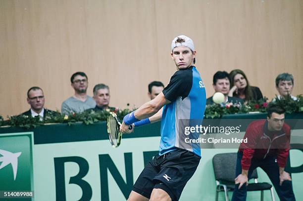 Blaz Rola of Slovenia in action against Marius Copil of Romania during day 1 of the Davis Cup World Group first round tie between Romania and...