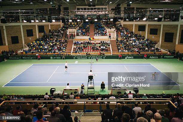 Adrian Ungur of Romania plays against Grega Zemlja of Slovenia during day 1 of the Davis Cup World Group first round tie between Romania and...