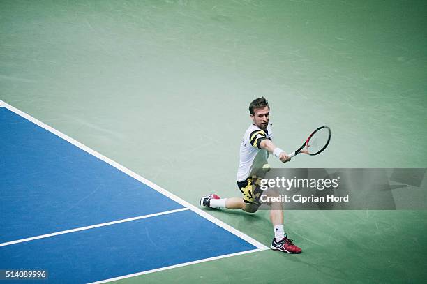 Adrian Ungur of Romania in action against Grega Zemlja of Slovenia during day 1 of the Davis Cup World Group first round tie between Romania and...