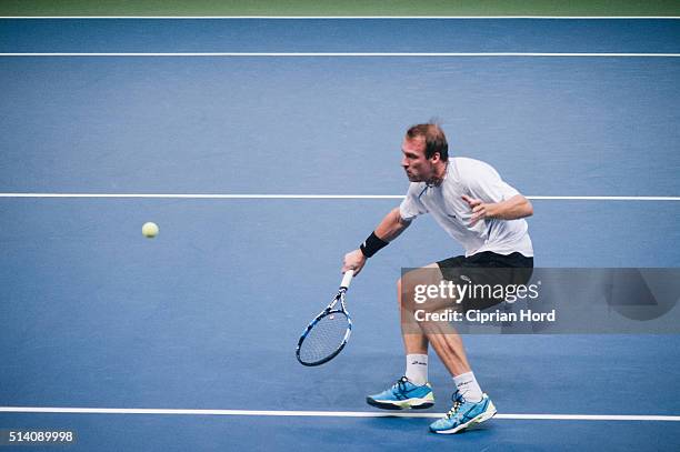 Grega Zemlja of Slovenia in action against Adrian Ungur of Romania during day 1 of the Davis Cup World Group first round tie between Romania and...