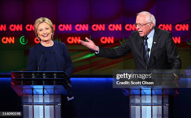 Democratic presidential candidate Senator Bernie Sanders and Democratic presidential candidate Hillary Clinton speak during the CNN Democratic...