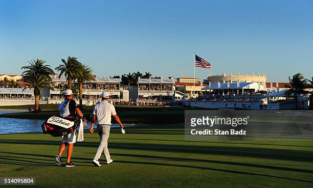 Adam Scott of Australia walks along the 18th hole during the final round of the World Golf Championships-Cadillac Championship at Trump National...