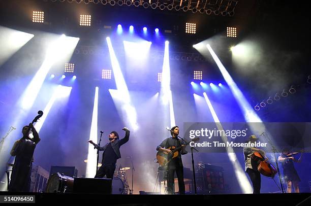 Bob Crawford Scott Avett, Seth Avett, Joe Kwon, and Tania Elizabeth of The Avett Brothers perform during the Okeechobee Music & Arts Festival on...