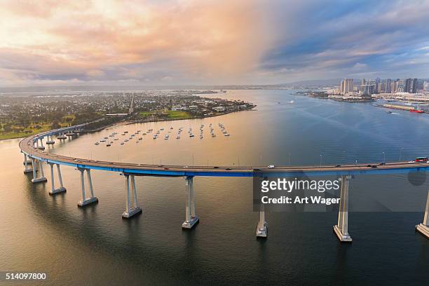 the coronado bridge at dusk from above - san diego stock pictures, royalty-free photos & images
