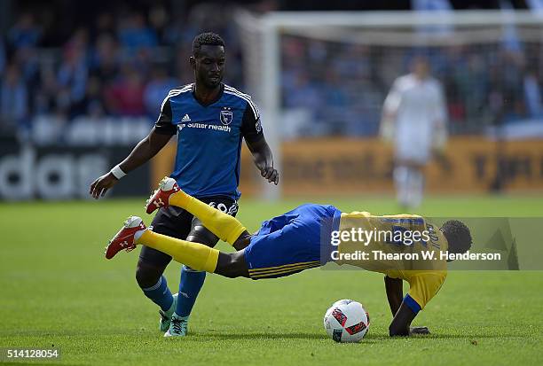 Dominique Badji of Colorado Rapids gets tripped by Simon Dawkins of San Jose Earthquakes during their MLS Soccer game in the first half at Avaya...