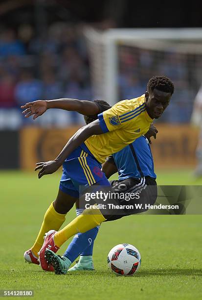 Dominique Badji of Colorado Rapids gets tripped by Simon Dawkins of San Jose Earthquakes during their MLS Soccer game in the first half at Avaya...