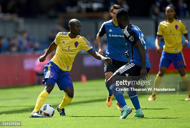 Michael Azira of Colorado Rapids dribbles the ball while guarded by Simon Dawkins of San Jose Earthquakes during their MLS Soccer game in the first...