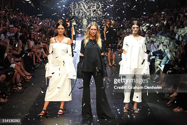 Jesinta Campbell, Erin Wasson and Montana Cox pose on the runway during the David Jones opening event as part of Virgin Australia Melbourne Fashion...