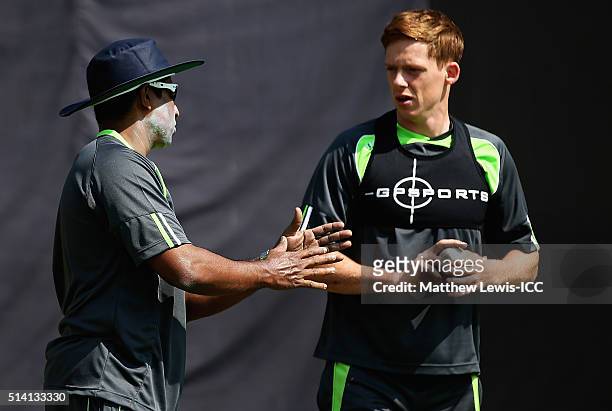 Bowling coach Chaminda Vaas of Ireland talks to Craig Young during a Training Session ahead of the ICC Twenty20 World Cup at HPCA Stadium on March 7,...