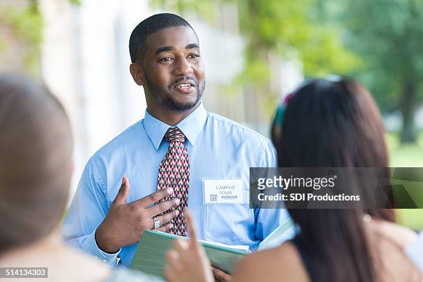tour guide director talking during college campus visit - college visit stock pictures, royalty-free photos & images