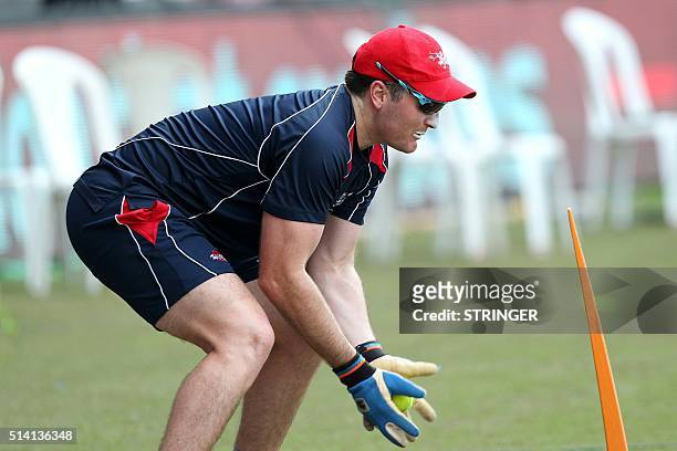 Hong Kong wicketkeeper Ryan Campbell takes part in a training session ahead of the forthcoming Cricket World Cup T20 tournament at the Vidarbha...