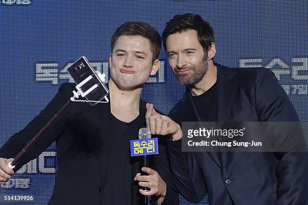Actors Taron Egerton and Hugh Jackman take a selfie as they attend the premiere for 'Eddie The Eagle' on March 7, 2016 in Seoul, South Korea. Taron...