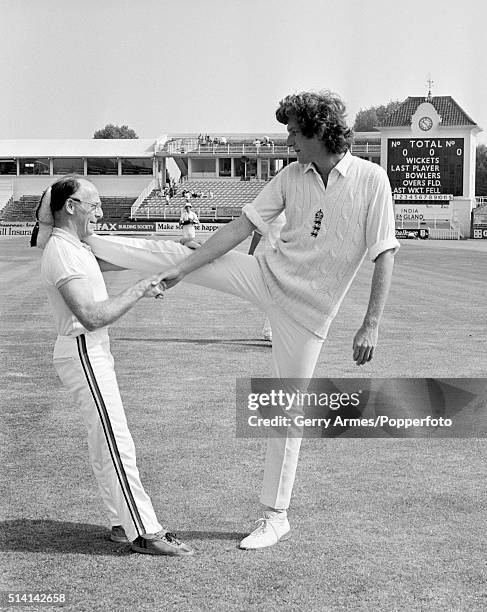 Warwickshire and England fast bowler Bob Willis limbers up with physio Bernard Thomas prior to the 1st Test match at Edgbaston in Birmingham, 12th...
