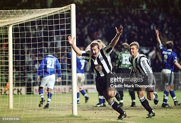 Newcastle United striker Alan Shearer celebrates with Lee Clark after completing his hat trick and a 4-3 FA Premier League win for Newcastle after...