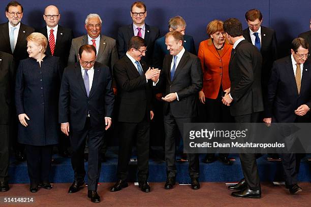 European council president, Donald Tusk and Turkish Prime Minister Ahmet Davutoglu share a joke during the family photo call at The European Council...