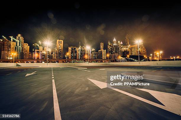 dubai skyline nightshot - dubai palm stock pictures, royalty-free photos & images