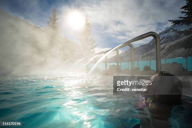 young asia woman enjoy hot spring under sunshine - health spa stock pictures, royalty-free photos & images