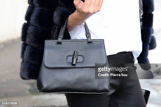 Jessica Hart, handbag detail, arrives at the Giambattista Valli show as part of the Paris Fashion Week Womenswear Fall/Winter 2016/2017 on March 7,...