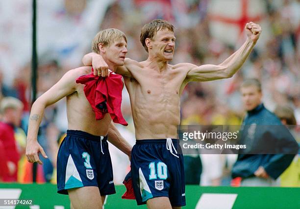 England players Stuart Pearce and Teddy Sheringham celebrate after the 1996 European Championships quarter final match victory against Spain at...