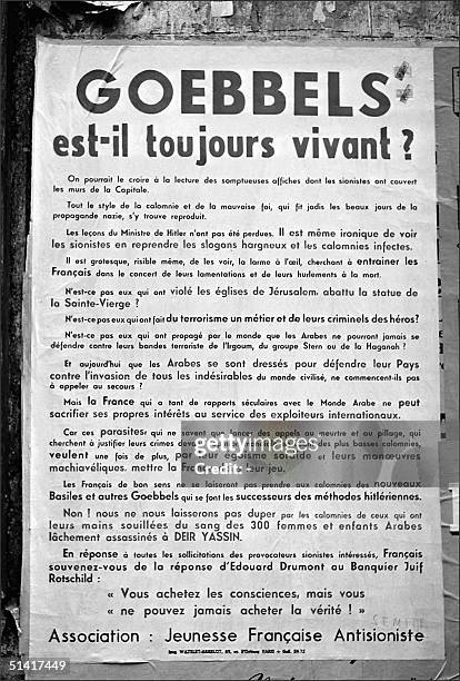 French violent anti-zionist and anti-semitic placard is pasted up 13 May 1948 on a Paris wall comparing Israeli Jews to the Nazis and denouncing,...