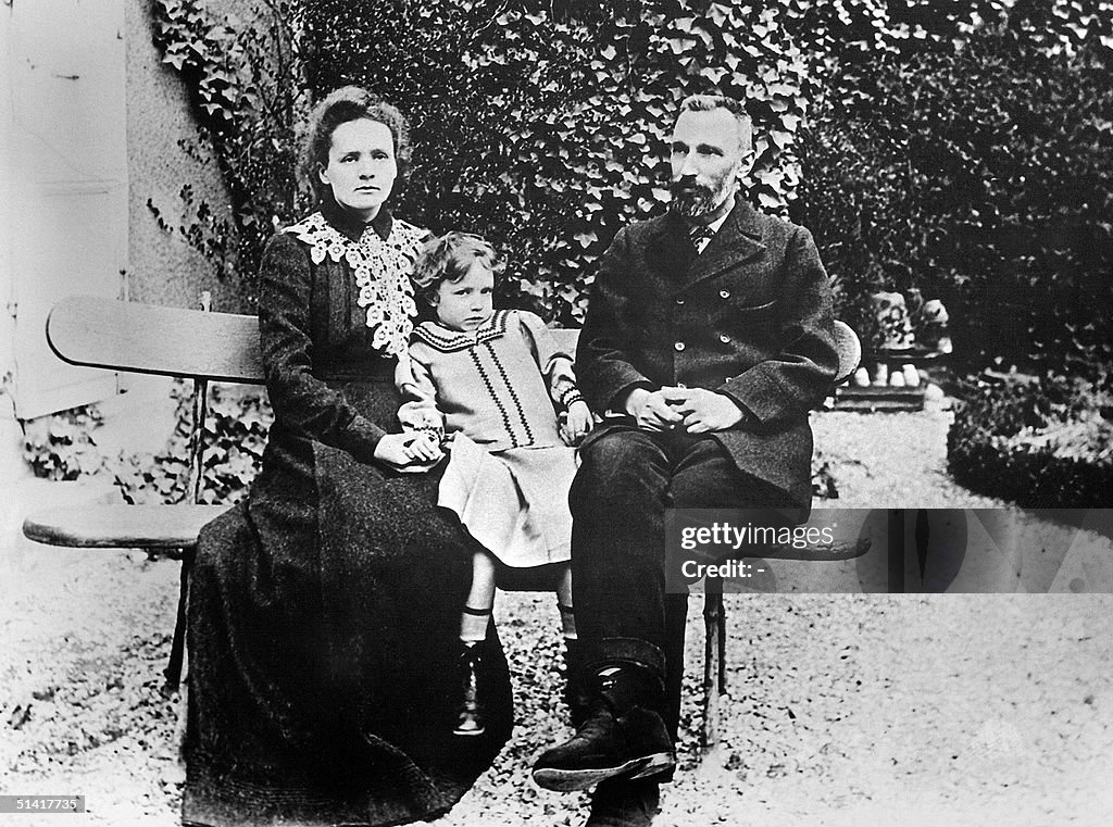 Picture dated 1904 shows Marie Curie holding her d