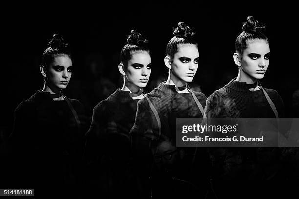 Model l walks the runway during the the Sacai show as part of the Paris Fashion Week Womenswear Fall/Winter 2016/2017 on March 7, 2016 in Paris,...