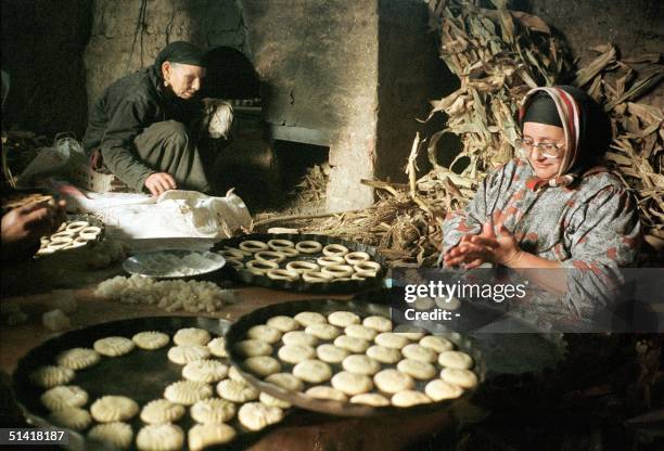 An Egyptian woman prepares 17 January traditional cookies for the three-day Eid al-Fitr festival in the village of Tanta, north of Cairo. Eid will...
