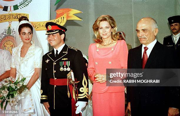 Picture dated 10 June 1993 shows Jordanian Crown Prince Abdullah and his wife Rania on their wedding day in Amman with King Hussein and Queen Noor ....