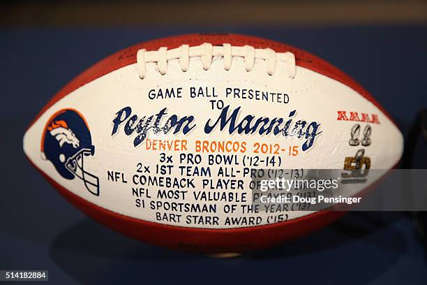 Game ball presented to NFL quarterback Peyton Manning by the Denver Broncos is seen prior to Manning's retirement press conference at the UCHealth...