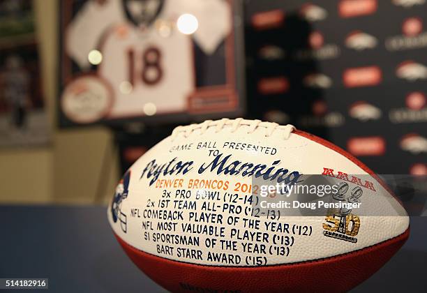 Game ball presented to NFL quarterback Peyton Manning by the Denver Broncos is seen prior to Manning's retirement press conference at the UCHealth...