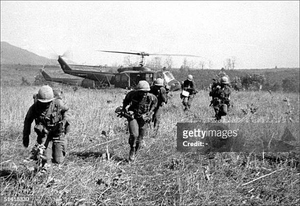 American soldiers get off helicopters during the operation "Double eagle" against a Vietcong position at Bon Son, south Vietnam, 07 March 1966.