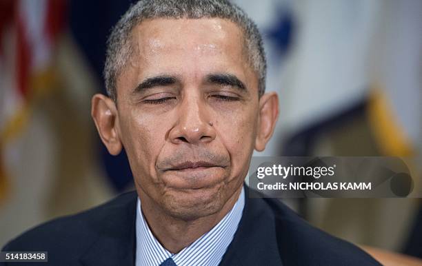 President Barack Obama speaks to the press following a meeting with financial regulators at the White House in Washington, DC, on March 7, 2016 to...