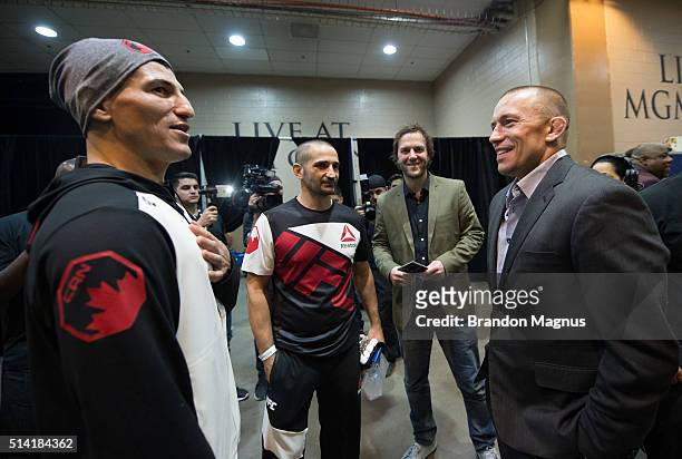 Nordine Taleb and UFC welterweight Georges St-Pierre talk backstage during the UFC 196 in the MGM Grand Garden Arena on March 5, 2016 in Las Vegas,...
