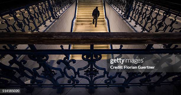 Man goes upstairs to the train station Treptower Park on March 07, 2016 in Berlin, Germany.