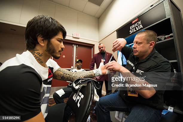 Erick Silva gets his hands wrapped backstage during the UFC 196 in the MGM Grand Garden Arena on March 5, 2016 in Las Vegas, Nevada.
