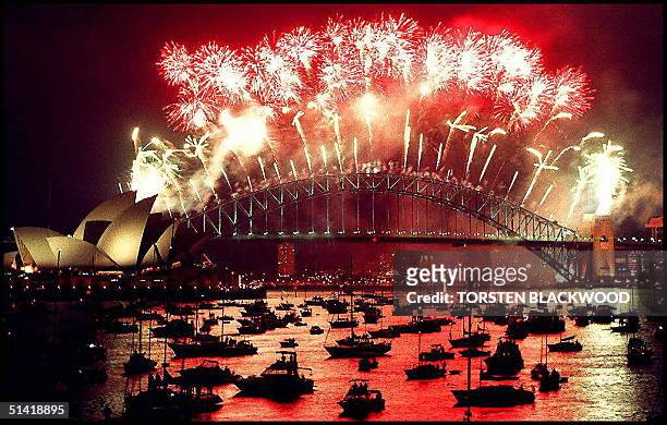 Sydney Harbour Bridge is illuminated by a New Year's Eve fireworks display 31 December which police and organisers used as a rehearsal for the Sydney...