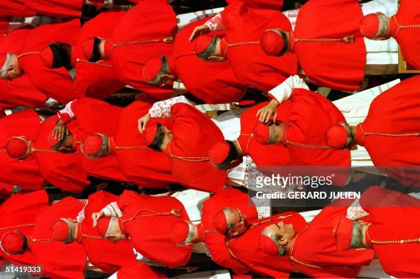 Newly appointed cardinals assist at a ceremony known as the "consistory" 21 February at Saint Peter's square in the Vatican. Pope John Paul II...