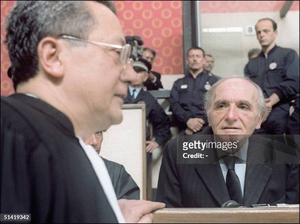 Former Gestapo chief in Lyon during WW-II and Nazi war criminal Klaus Barbie talks to his defender, a high-profile French lawyer Jacques VergFs...