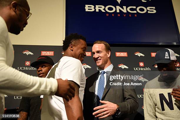 Denver Broncos quarterback Peyton Manning hugs Demaryius Thomas after a press conference to announce his retirement March 7, 2016 at UCHealth...