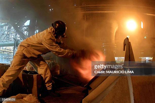 Worker at a blast furnace of the Compania Siderurgica Paulista , 26 June 2001, burns part of the 140 tons of repossesed drugs, in Cubatao, 80 km...