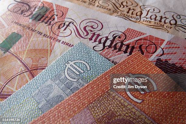 Detail of a fifty Pound bank note and a five and ten Euro note, on March 7, 2016 in London, England.