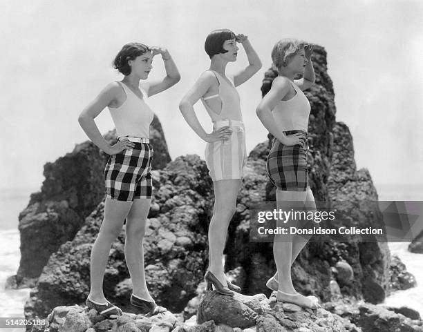 Actress Louise Brooks poses for a portrait session with 2 other women in circa1925.