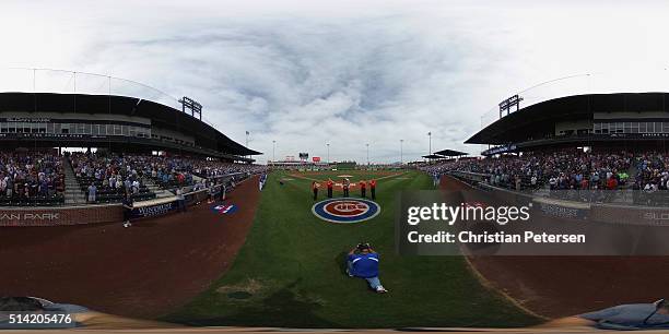 The national anthem is performed before the spring training game between the Kansas City Royals and Chicago Cubs at Sloan Park on March 7, 2016 in...