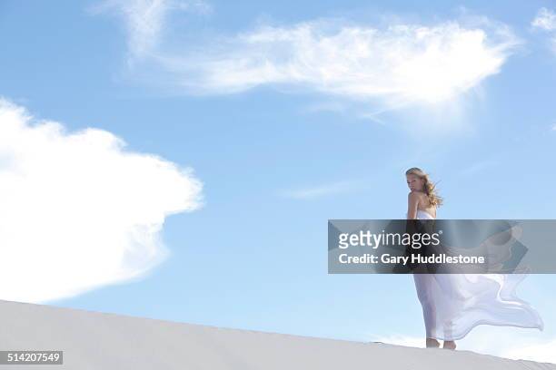 woman on dune in desert - white dress stock pictures, royalty-free photos & images