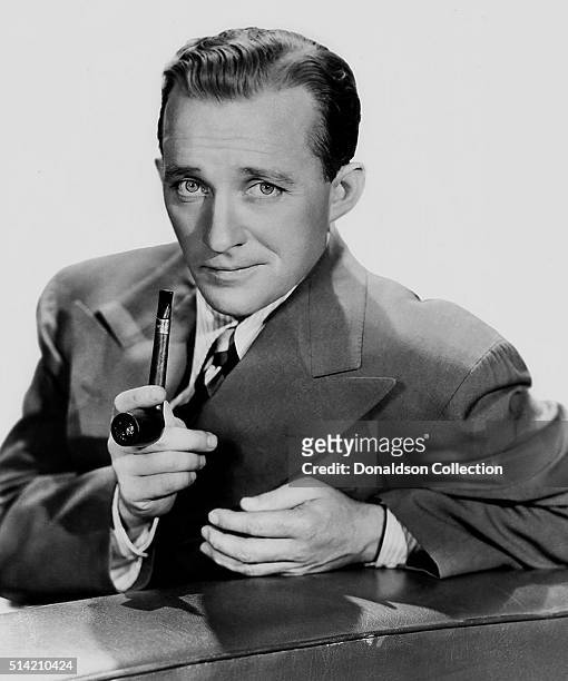 Actor Bing Crosby poses for a portrait with pipe in circa 1948.